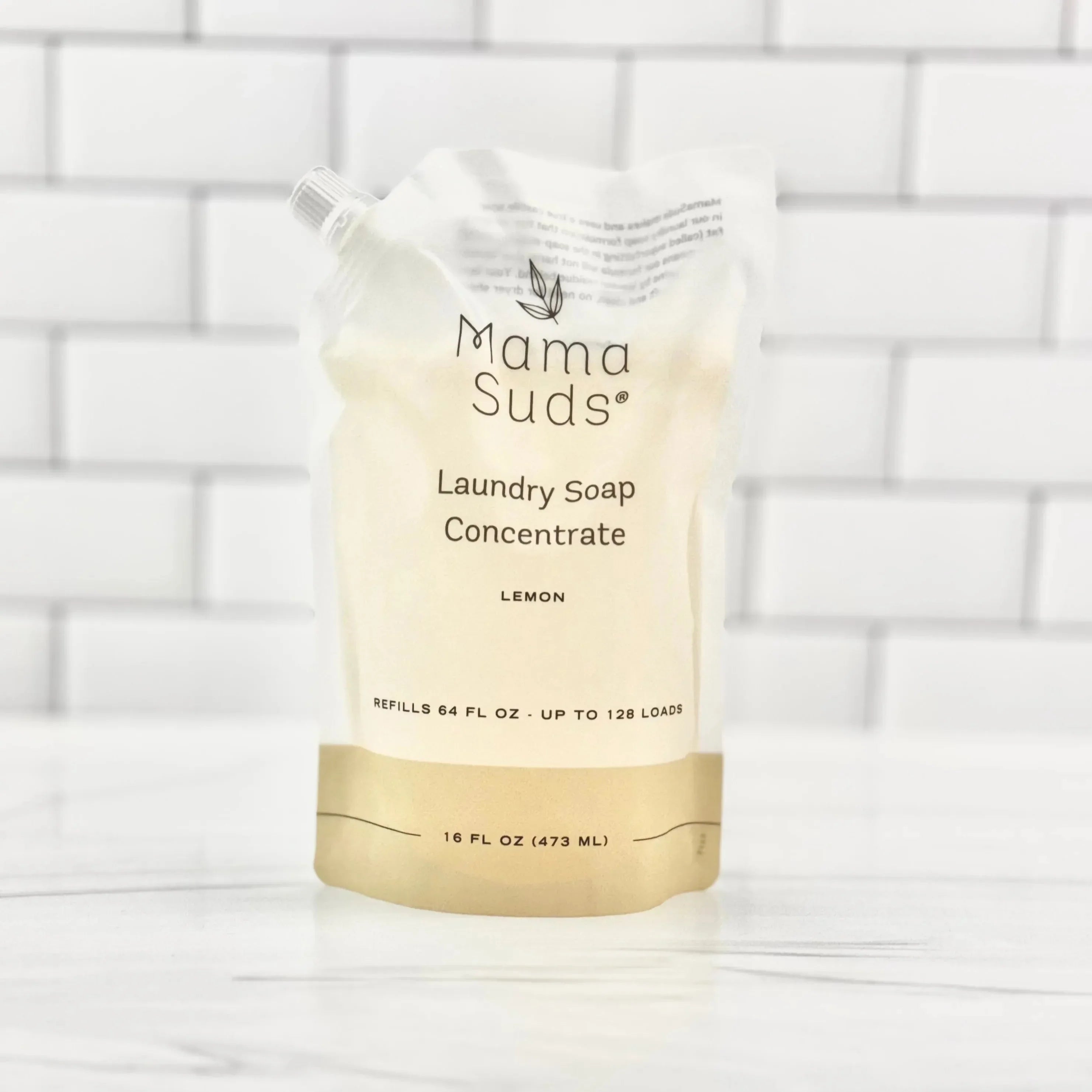 Mama Suds Laundry Soap Concentrate refill pouch, lemon scent, eco-friendly packaging on tile background