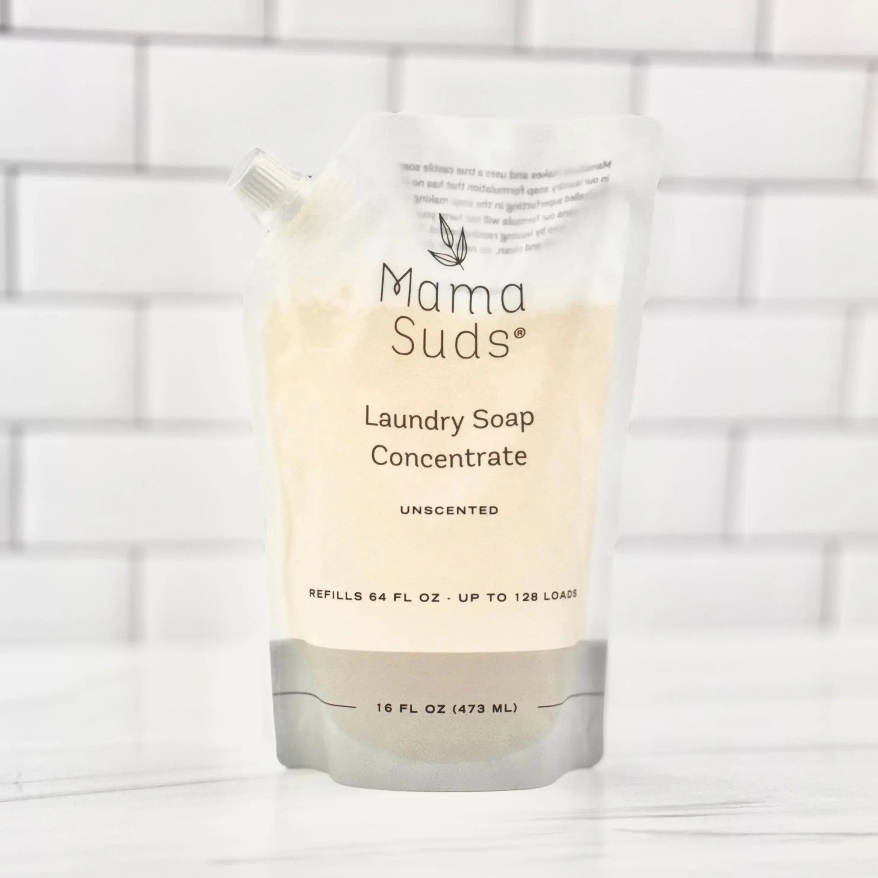 Mama Suds Laundry Soap Concentrate refill pouch on white tile, eco-friendly and unscented