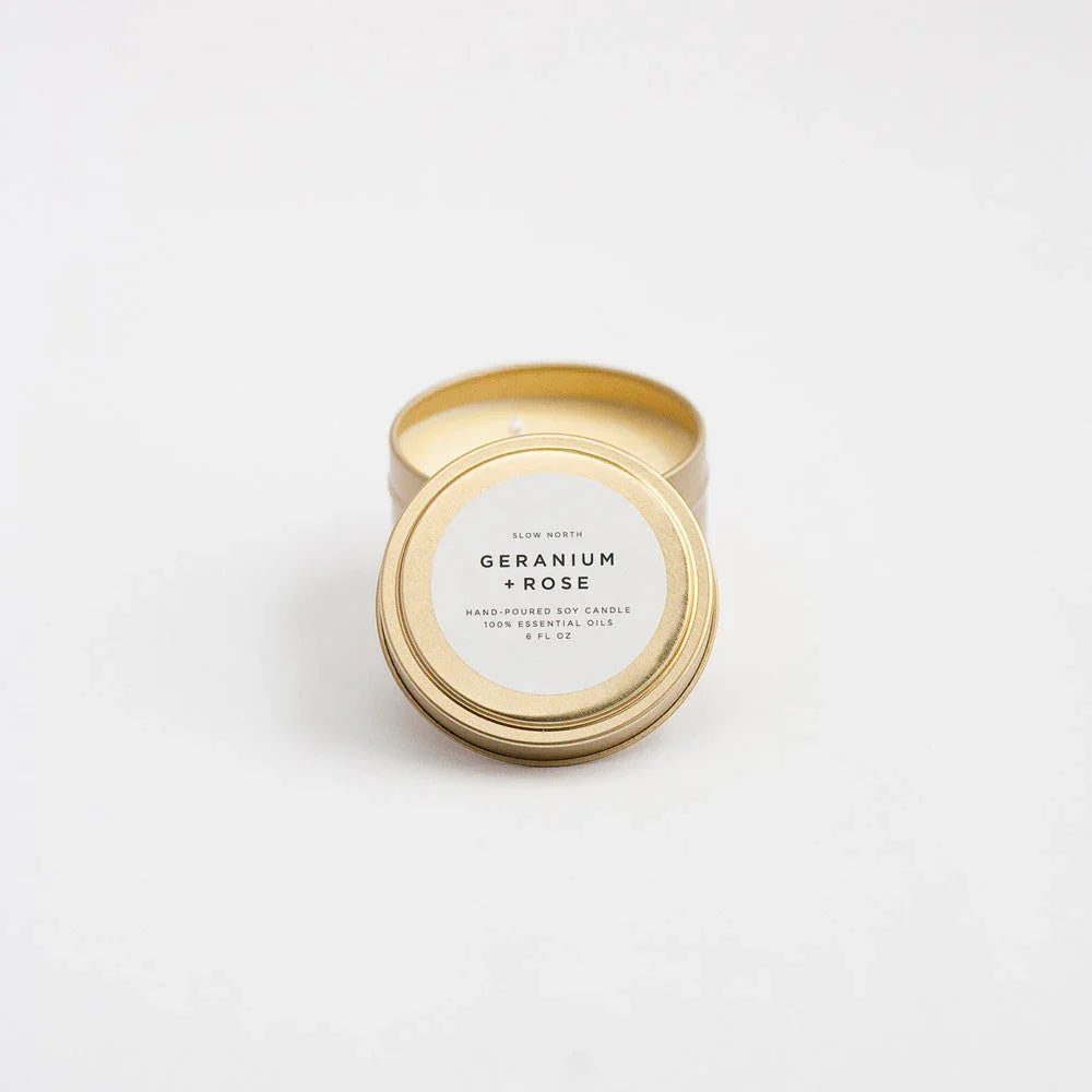 Geranium Rose hand-poured soy travel tin candle with gold lid on white background