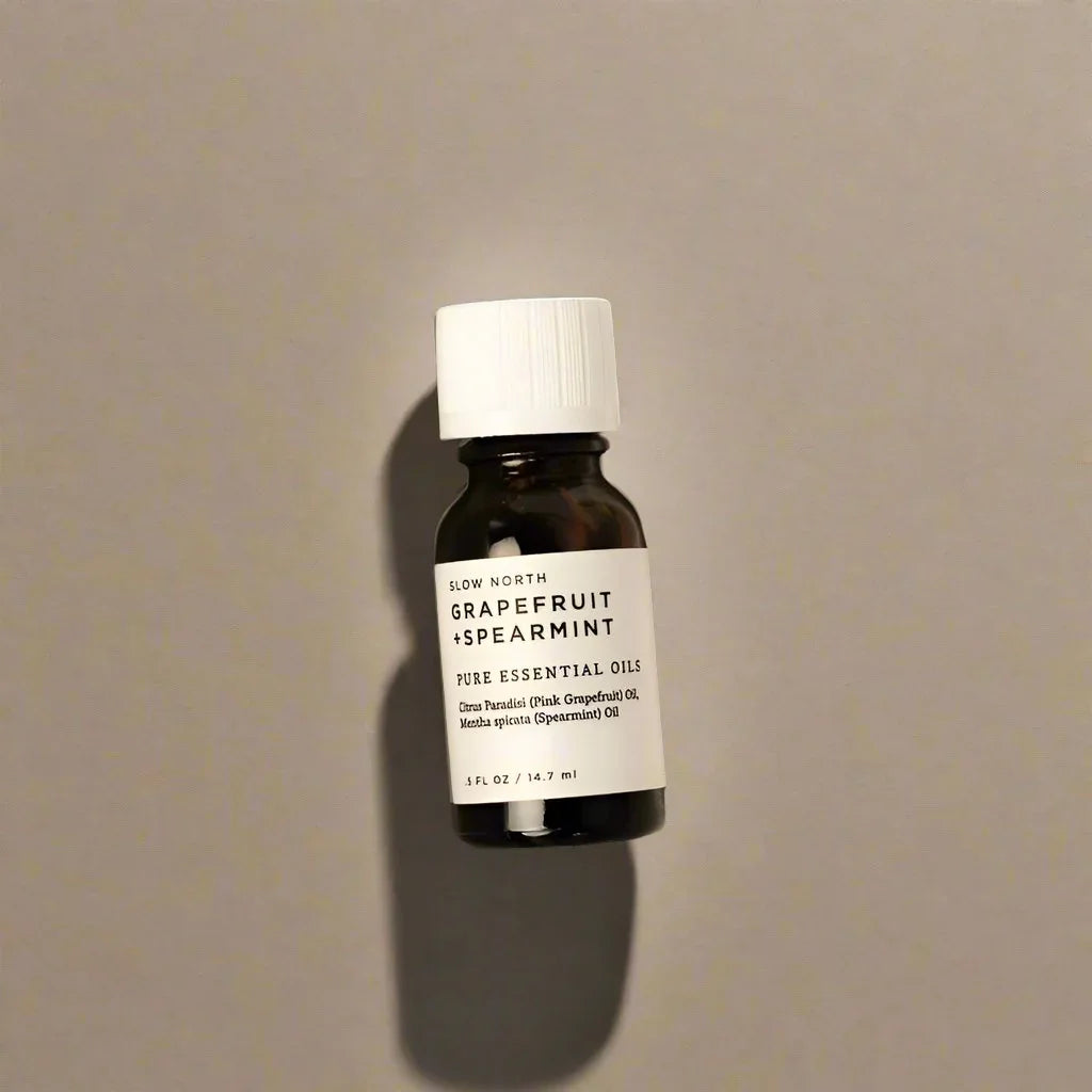 Slow North Grapefruit Spearmint essential oil bottle on neutral background, Qu!rk Boutique