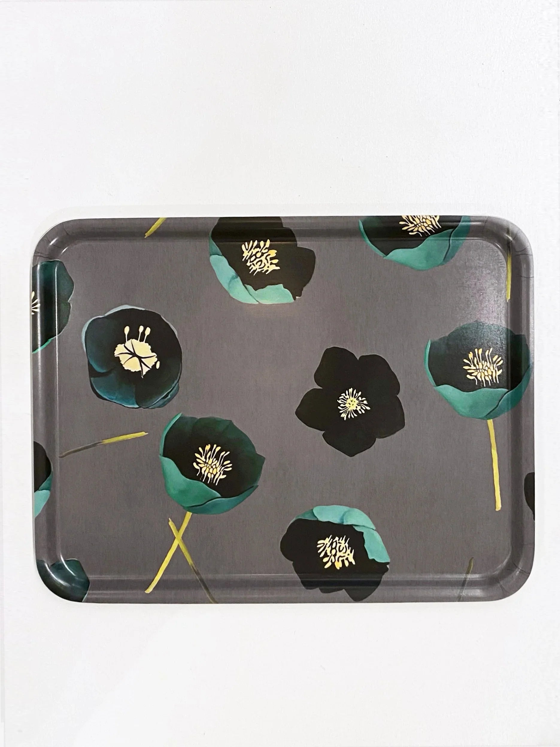 Rectangular serving tray with green and black winter rose floral pattern on gray background