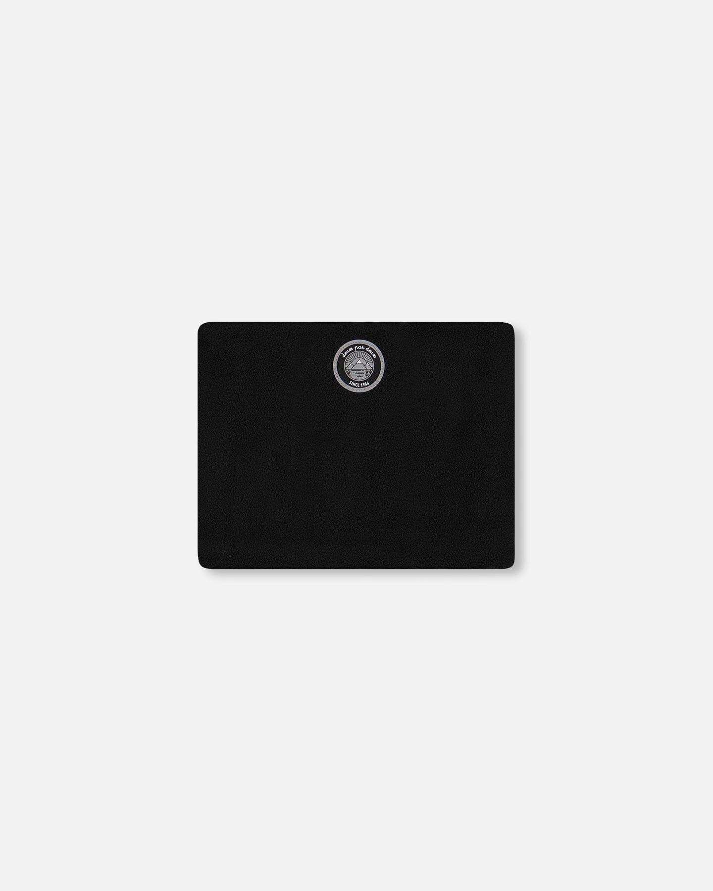 Black rectangular clutch with circular patch logo, minimalist style, Qu!rk Boutique accessory