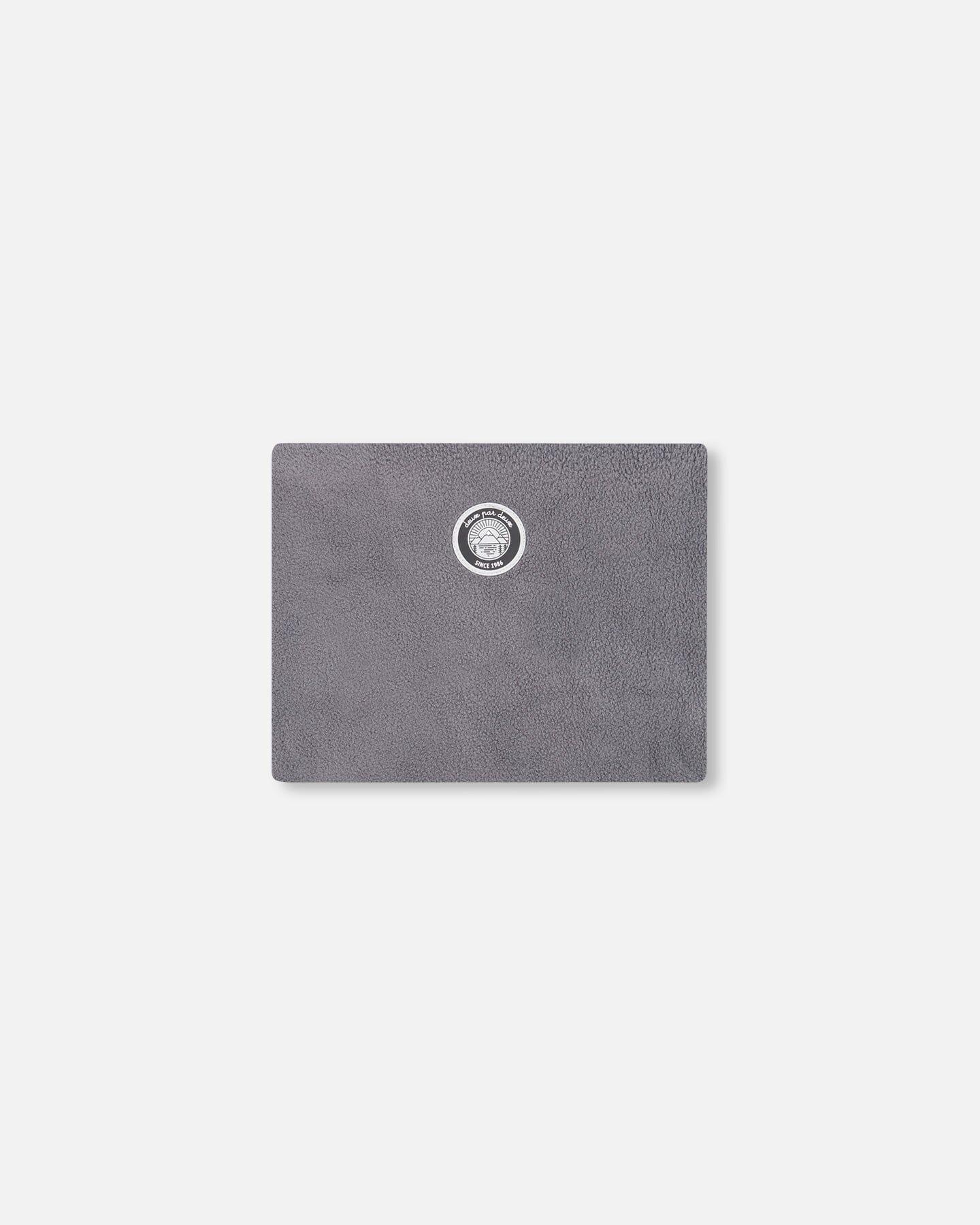 Gray faux fur pouch with circular logo on front, minimal style, Qu!rk Boutique accessory