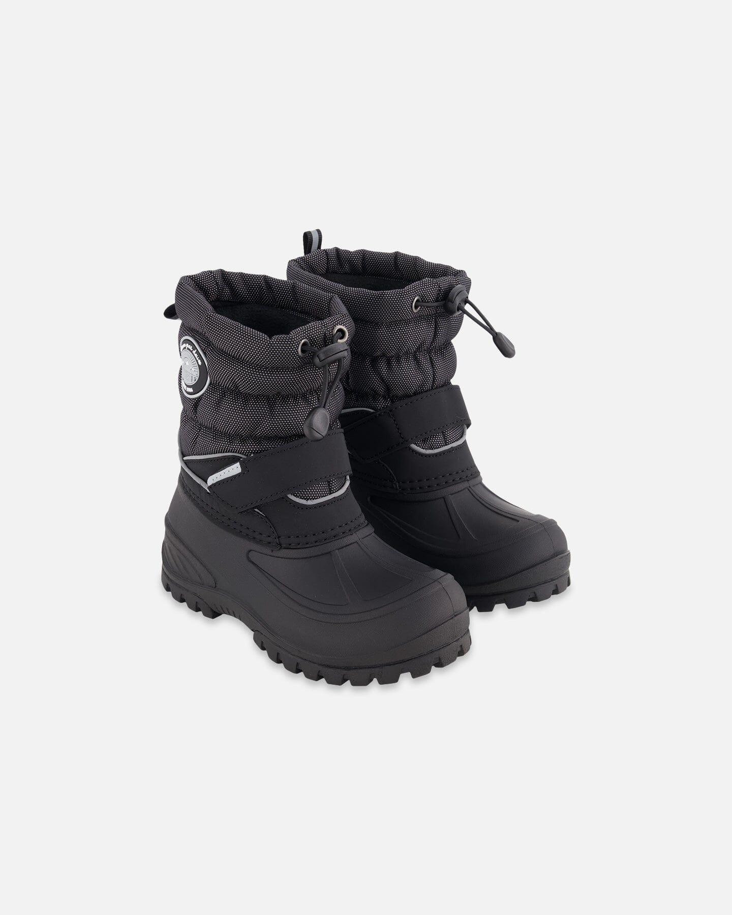 Black winter snow boots with rugged soles and drawstring cuffs on a white background, Qu!rk Boutique