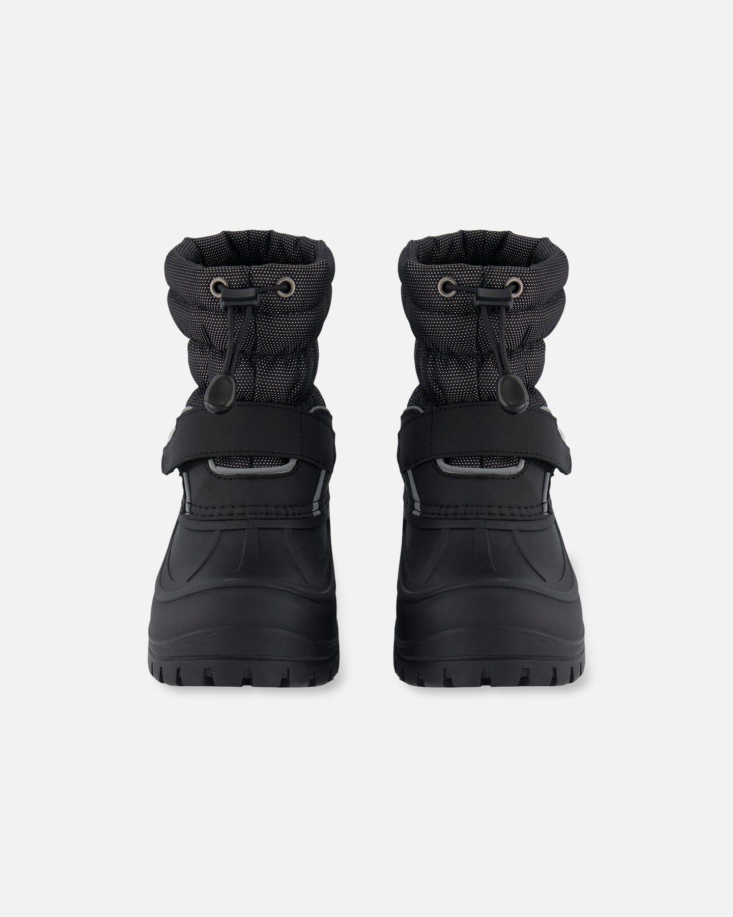 Black femme-fit winter boots with drawstring tops, photographed on white at Qu!rk Boutique