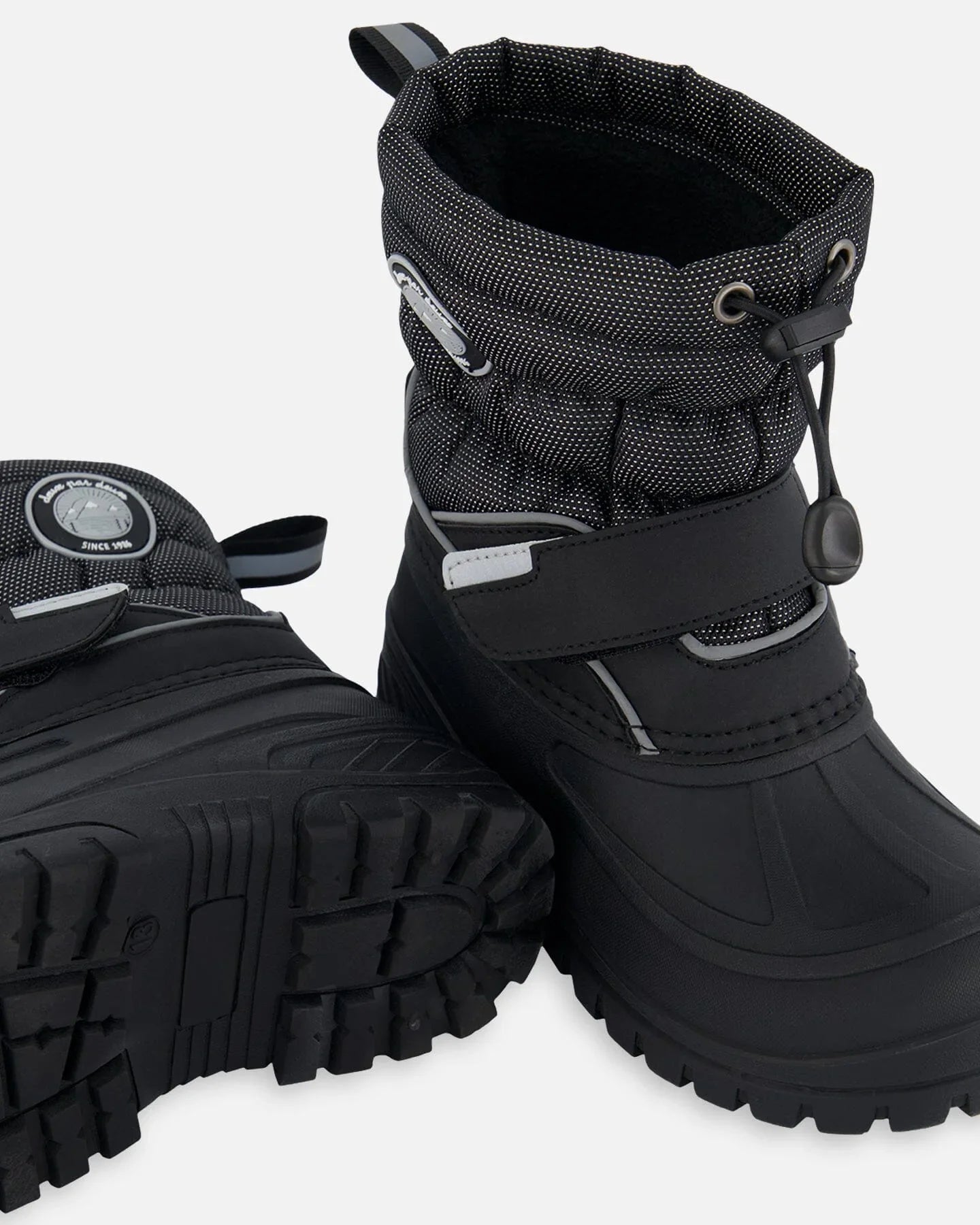 Black winter snow boots with rugged sole and drawstring top, femme-fit footwear from Qu!rk Boutique