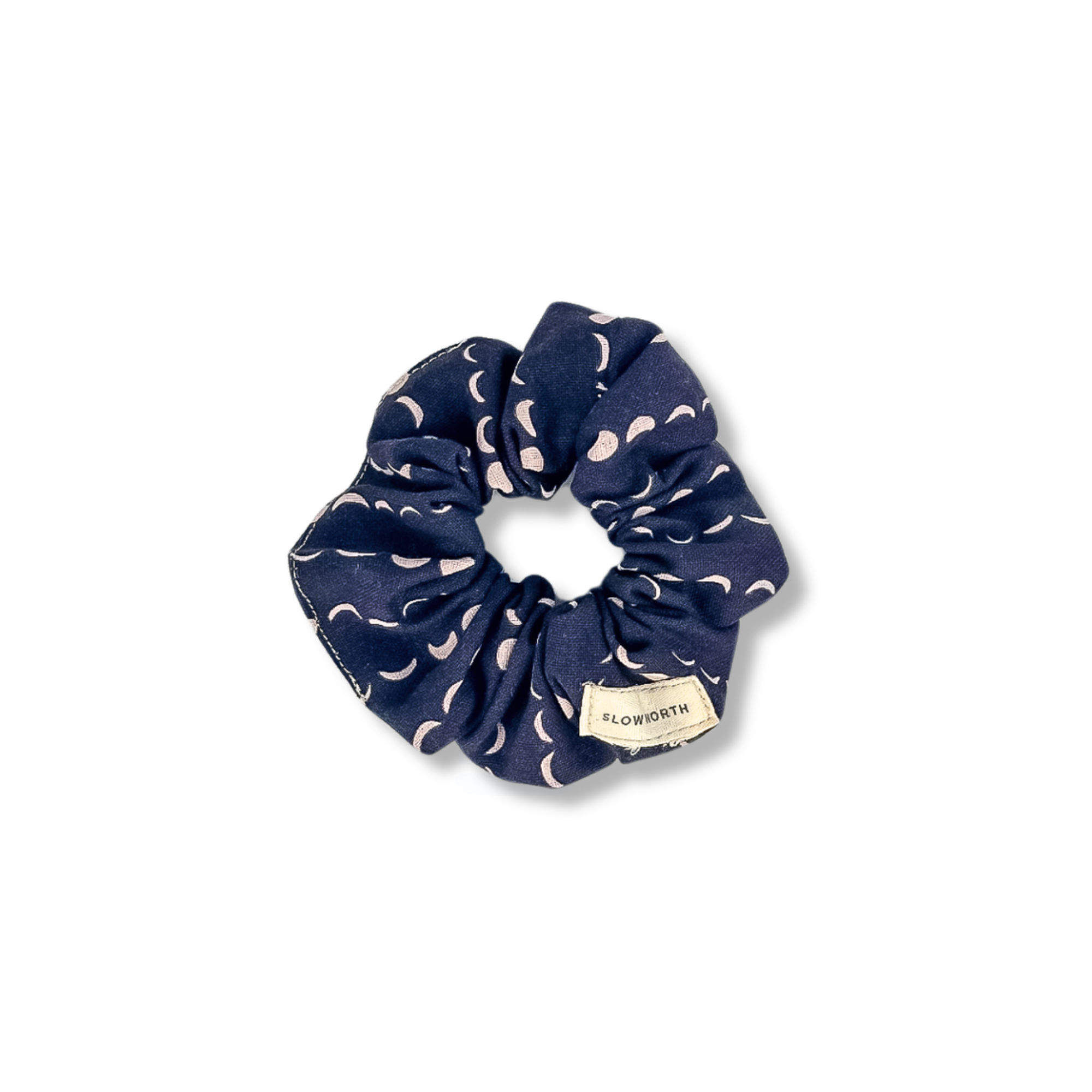 Navy blue fabric scrunchie with pink crescent pattern and Slowworth label
