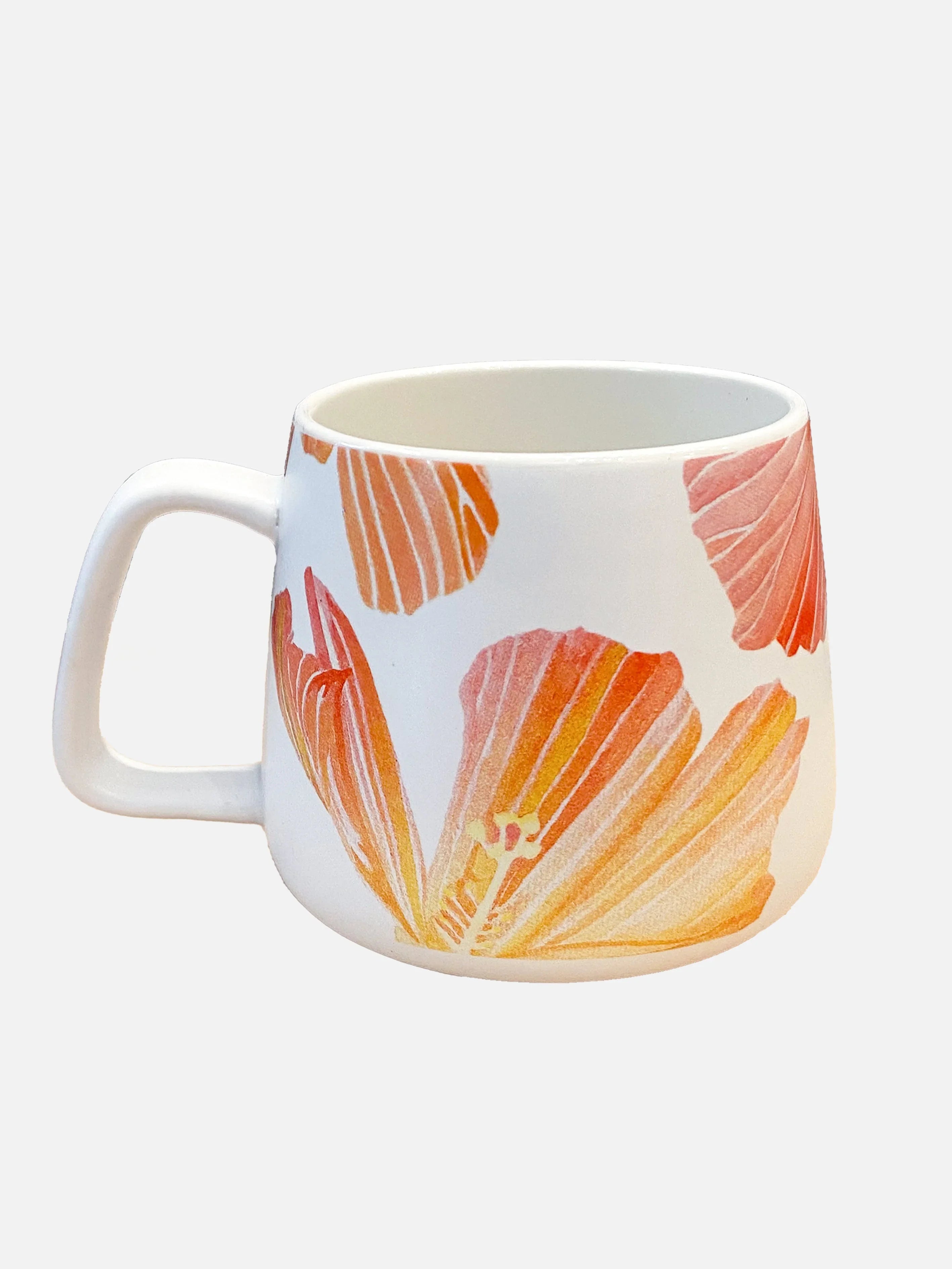White ceramic mug with large orange and pink hibiscus flower design and a wide handle