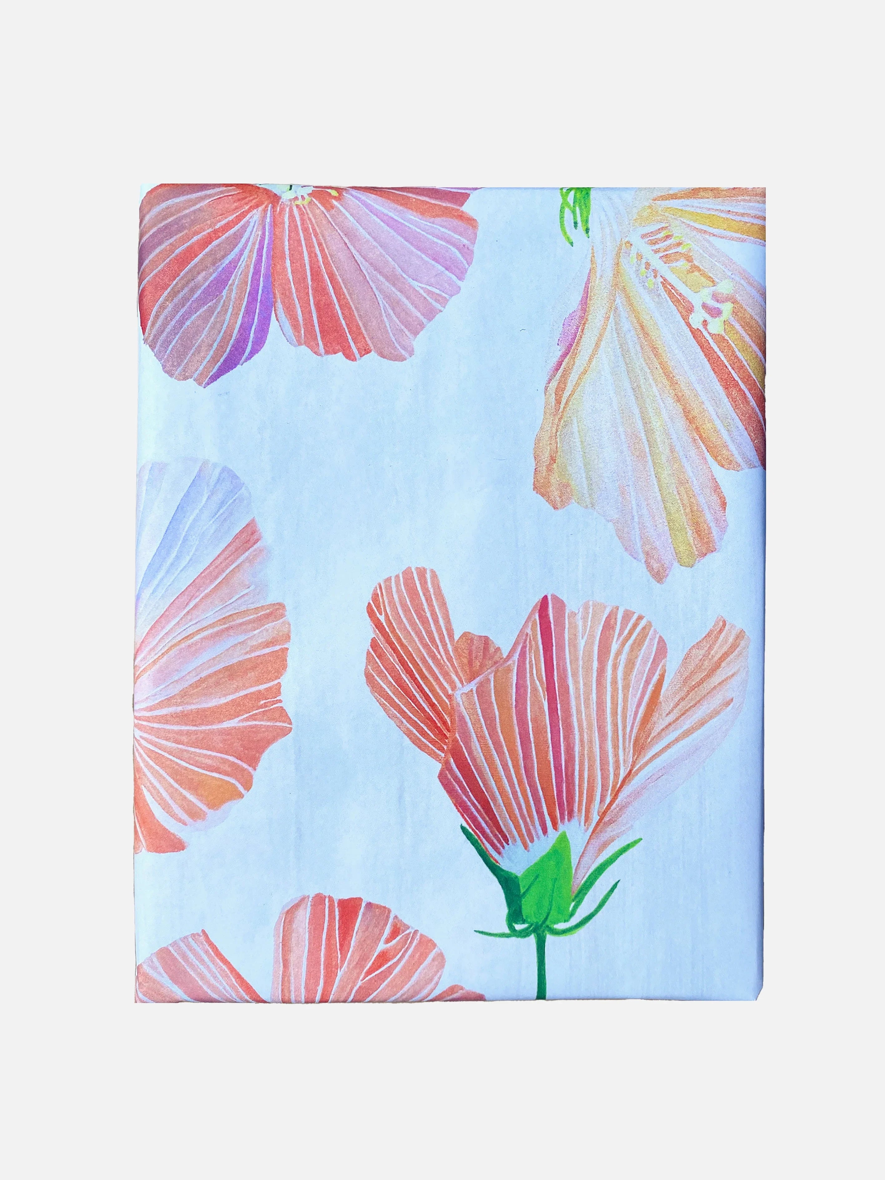 Hibiscus floral wrapping paper with large pink and orange petals on light blue background