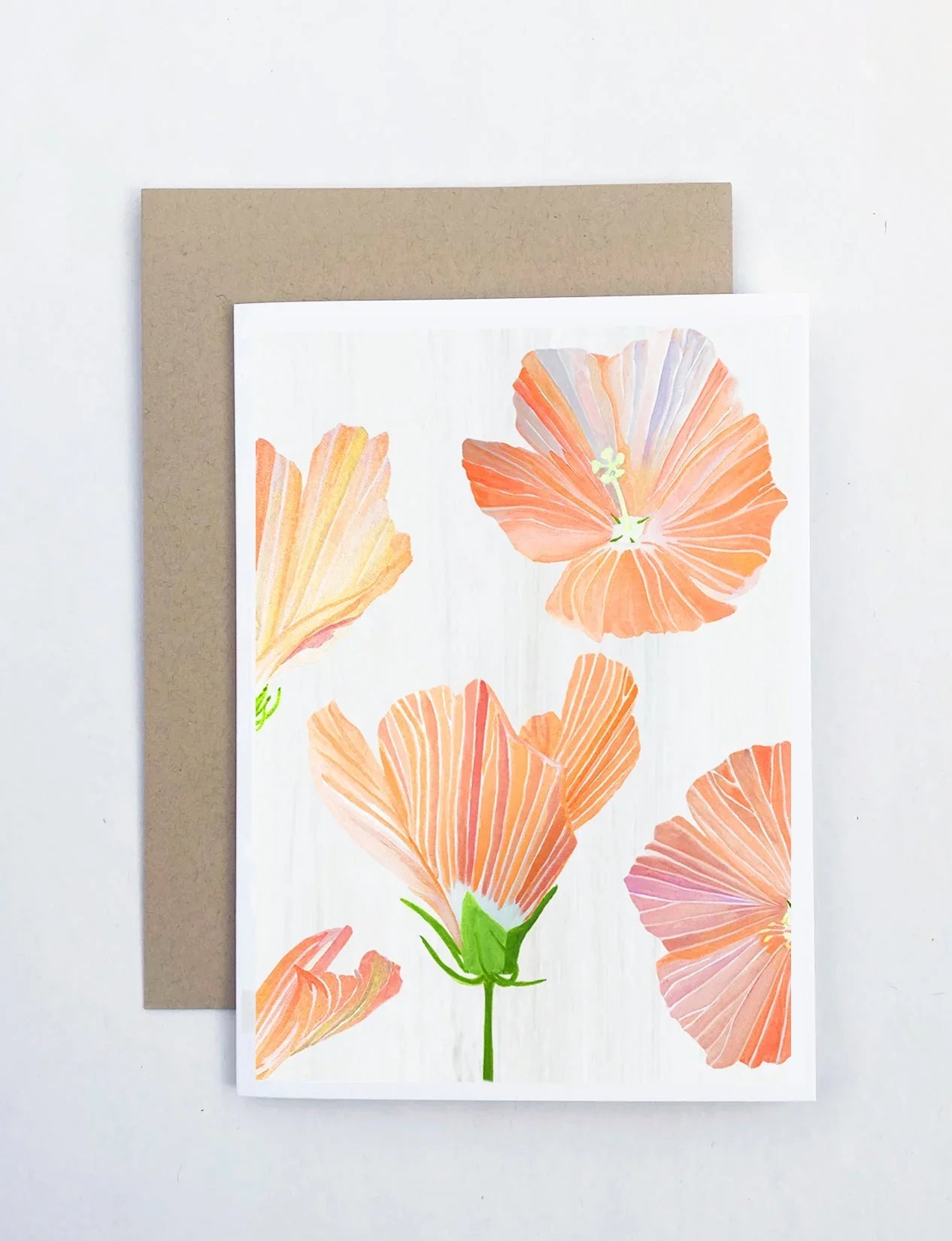Greeting card with watercolor orange hibiscus flowers on white background and brown envelope