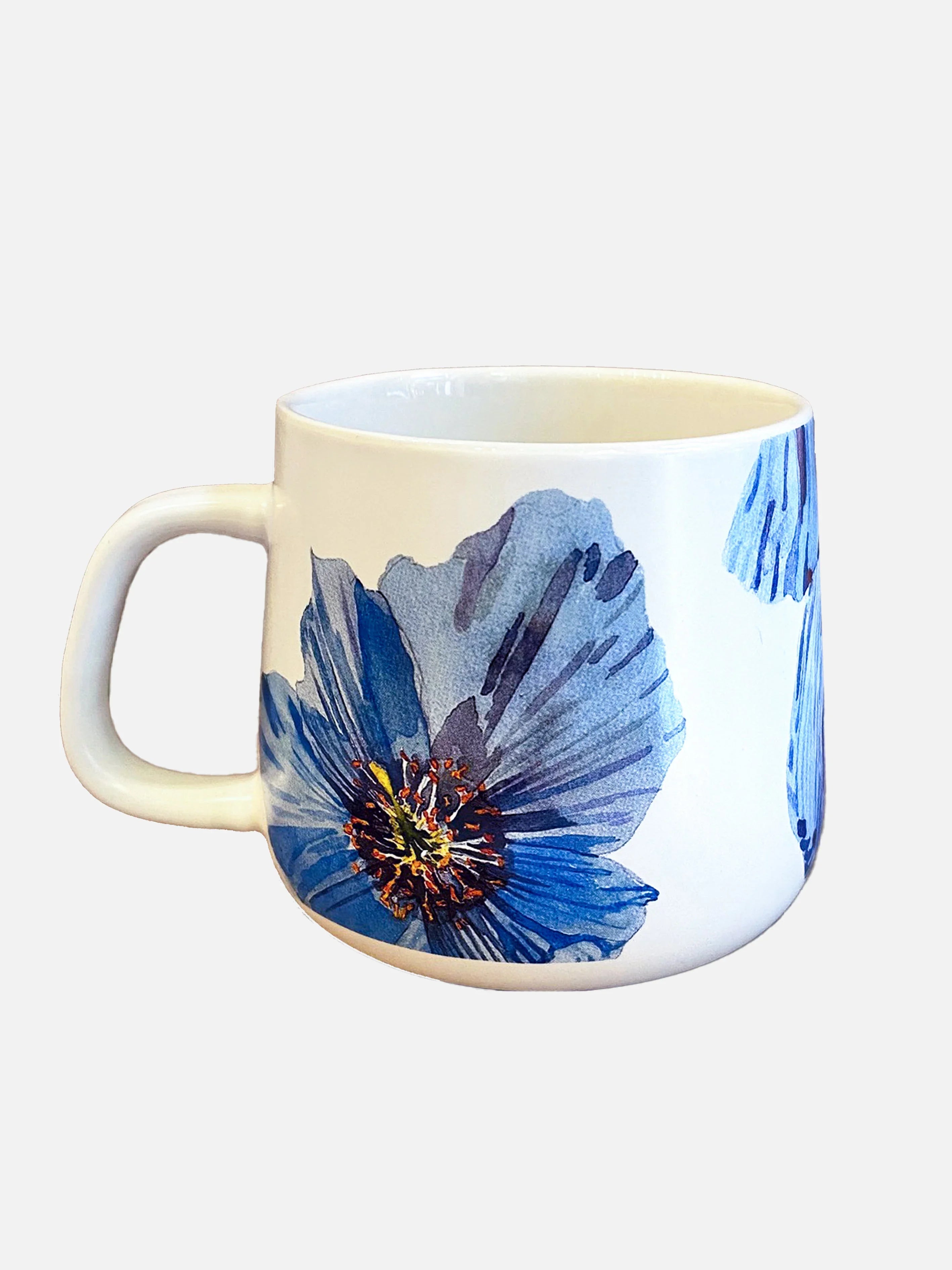 White ceramic mug with large blue Himalayan blue poppy floral design and a handle
