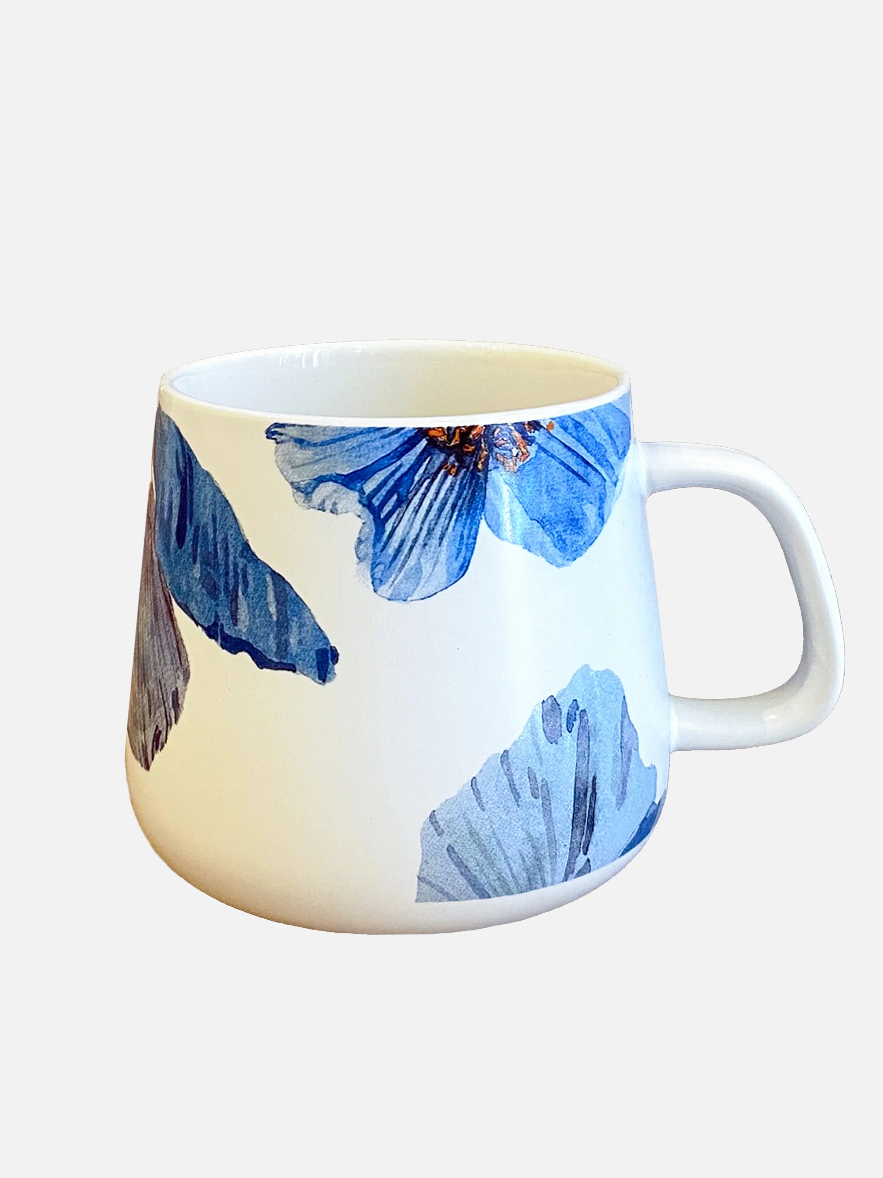 White ceramic mug with large blue Himalayan poppy flower design and a curved handle