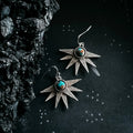 Starburst earrings with turquoise stone on cosmic black background, Qu!rk Boutique jewelry