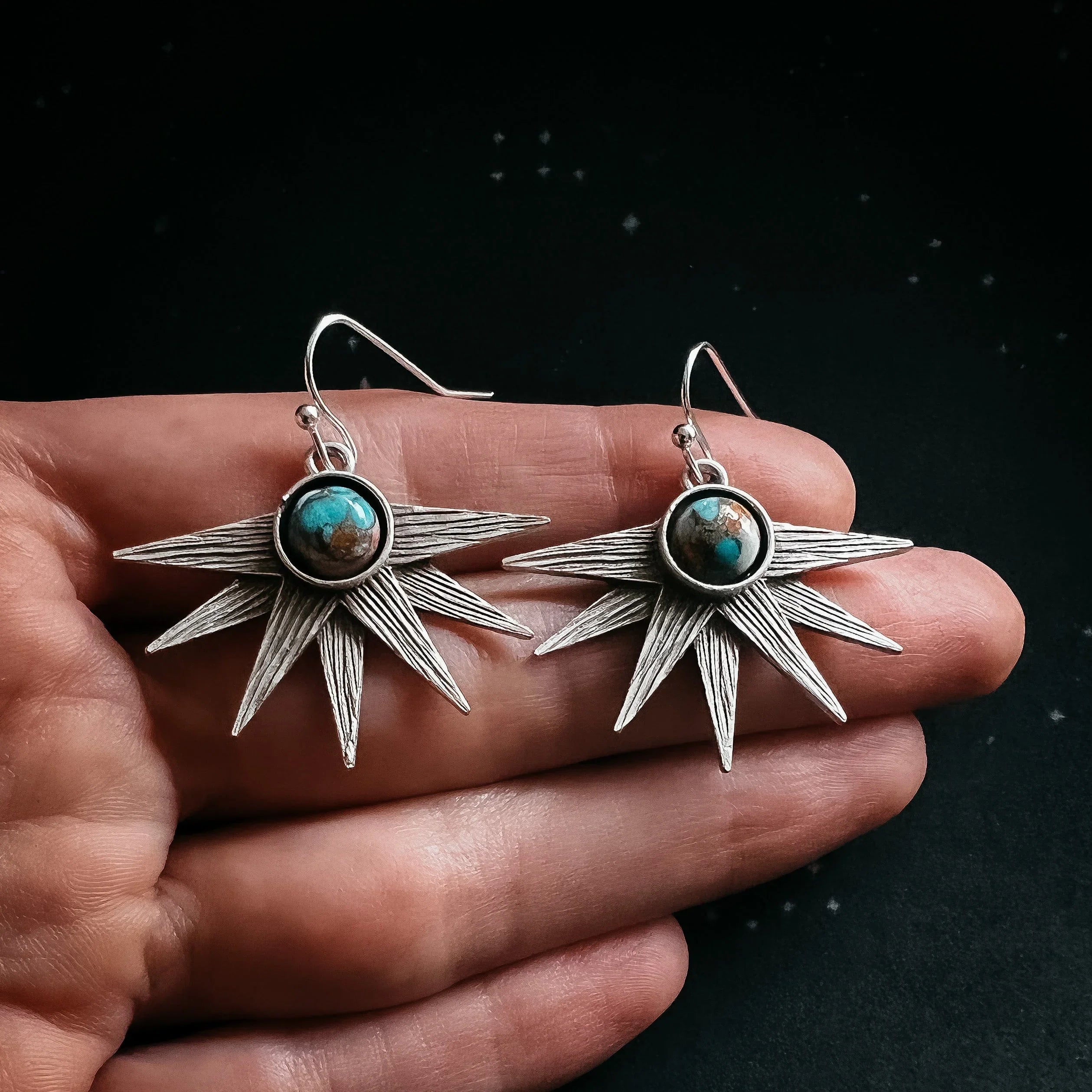 Silver starburst earrings with turquoise stone, handcrafted cosmic jewelry at Qu!rk Boutique