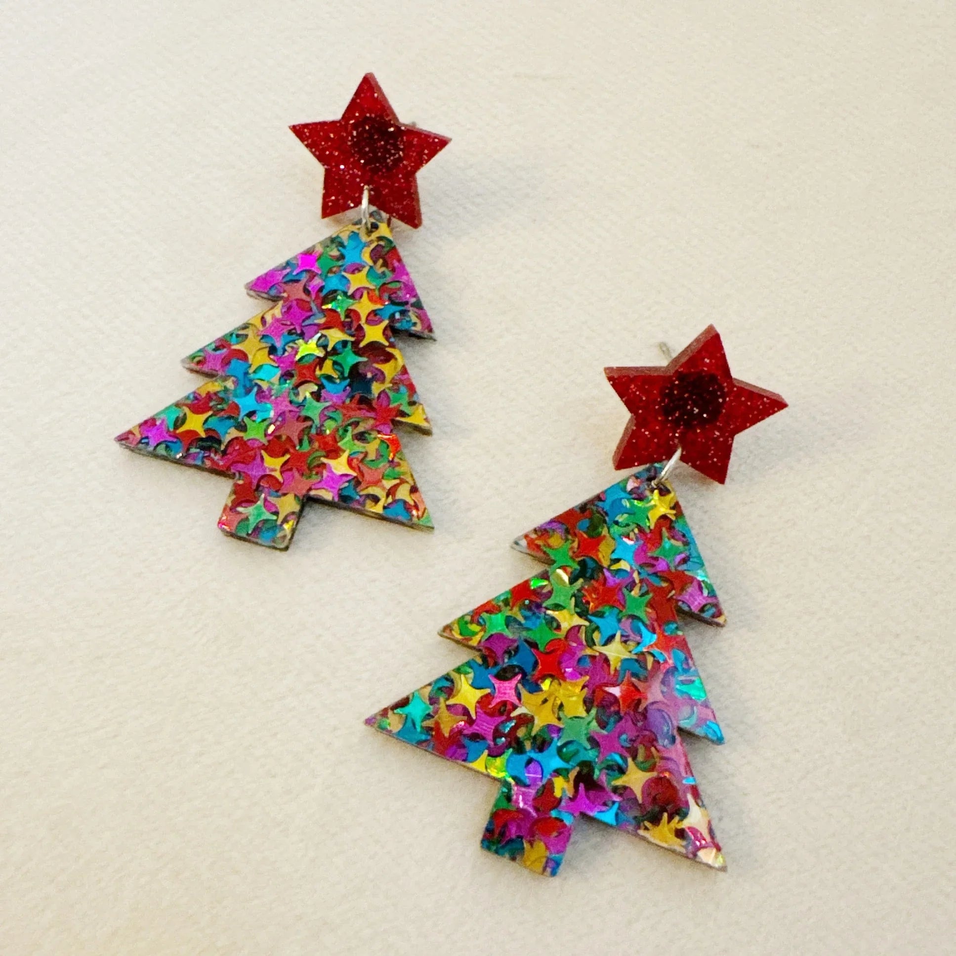 Colorful Christmas tree-shaped earrings with red star studs decorated with multicolor star sequins