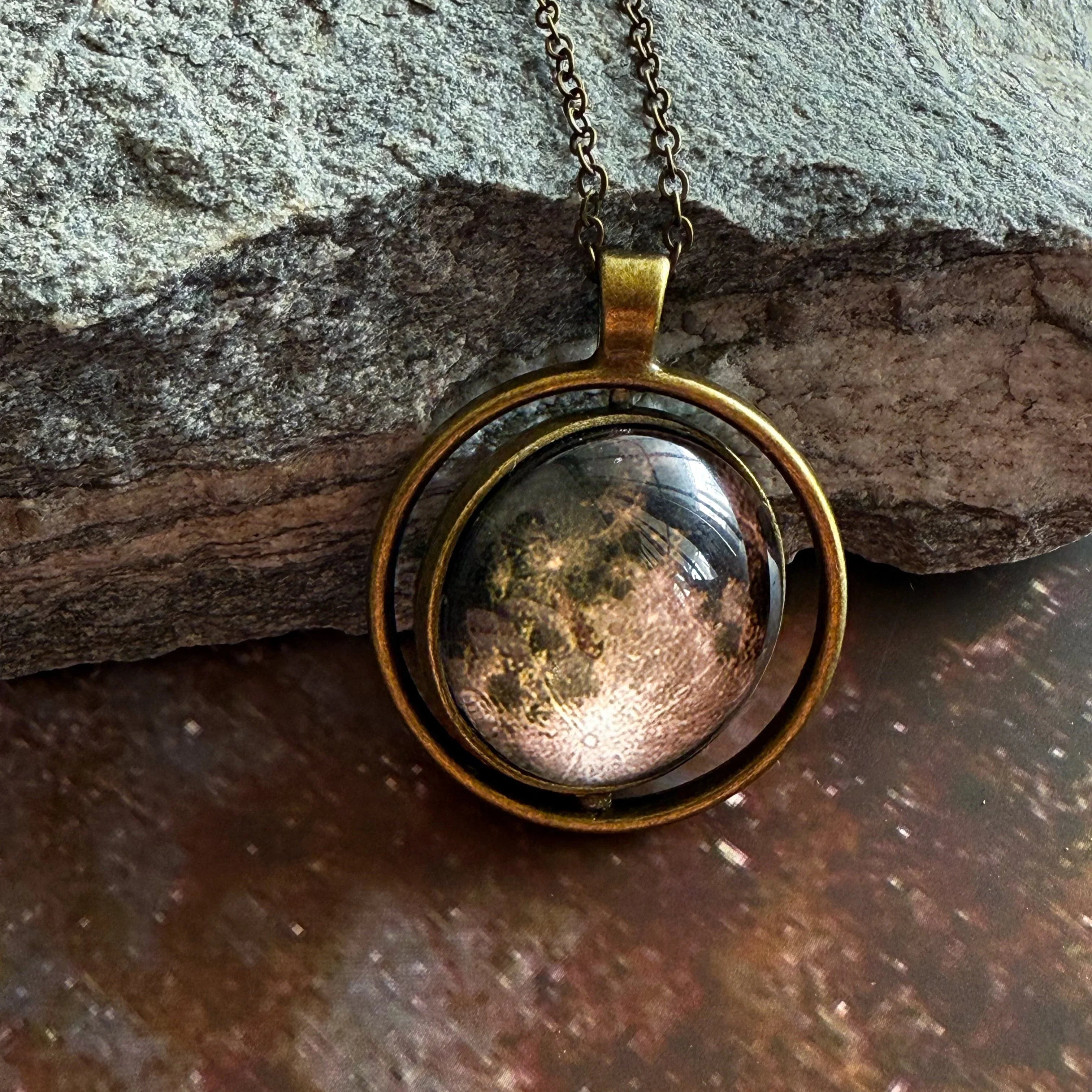 Cosmic moon pendant necklace with bronze setting on stone, Qu!rk Boutique artist-designed jewelry