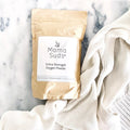 Mama Suds Extra Strength Oxygen Powder eco-friendly laundry detergent on white knit blanket