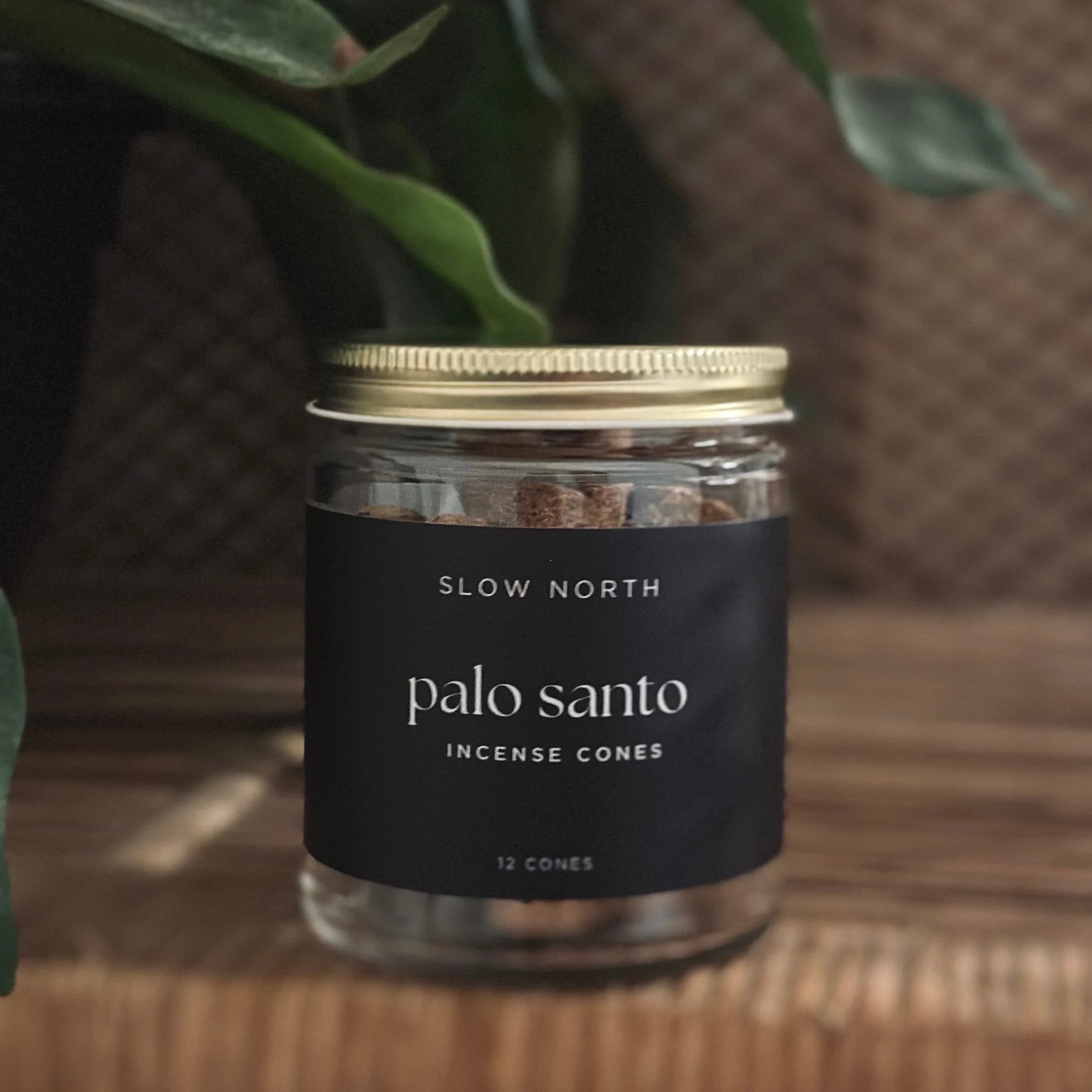 Slow North palo santo incense cones jar on wooden surface, boutique eco-friendly gift