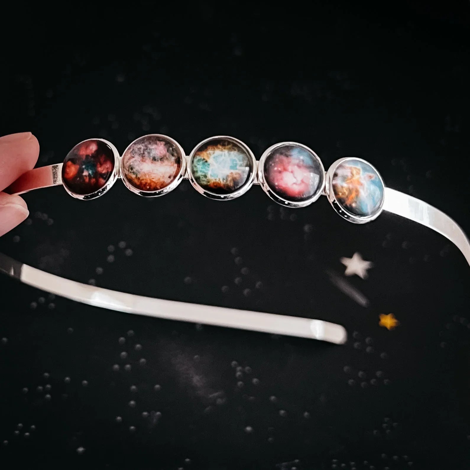 Cosmic galaxy headband with five nebula glass cabochons, artist-designed at Qu!rk Boutique.