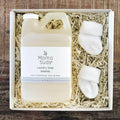 Mama Suds laundry soap gift box with baby socks on wood, Qu!rk Boutique eco-friendly gift