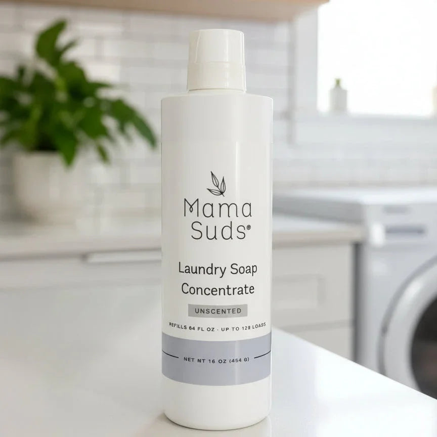 Mama Suds Laundry Soap Concentrate bottle on a laundry room counter, eco-friendly cleaning product