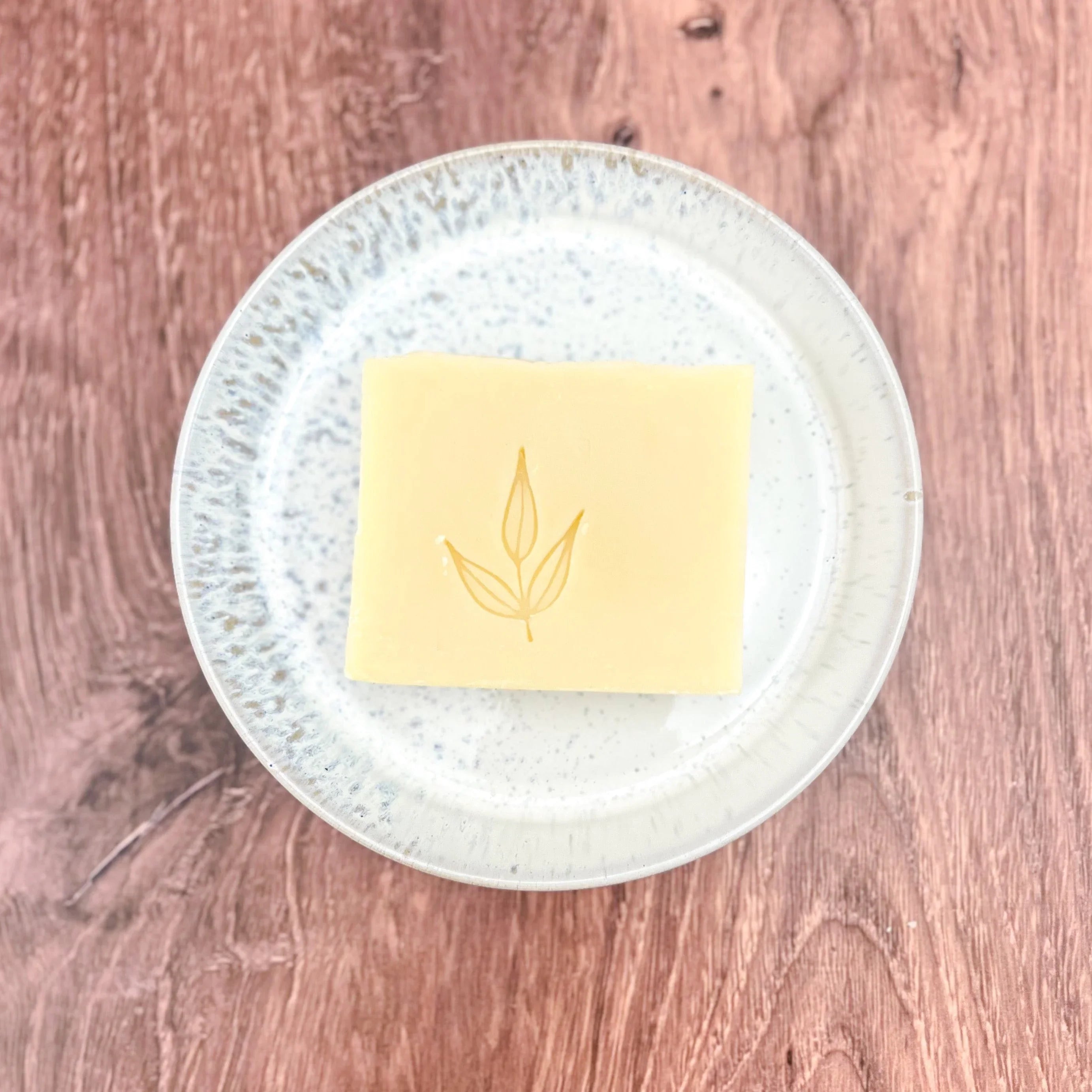 Artist-designed vegan bar soap on a ceramic plate, Qu!rk Boutique sustainable gift