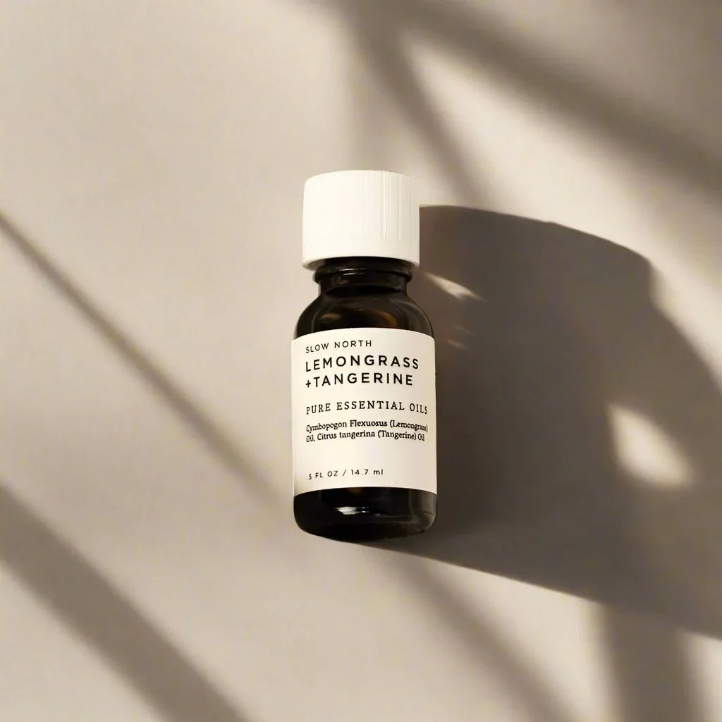 Lemongrass Tangerine essential oil diffuser blend bottle with minimalist label on neutral background