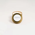 Slow North Lemongrass Tangerine travel tin soy candle with gold lid on white background
