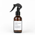 Slow North Linen Spray Forest Bathing in amber bottle with black spray top on white background