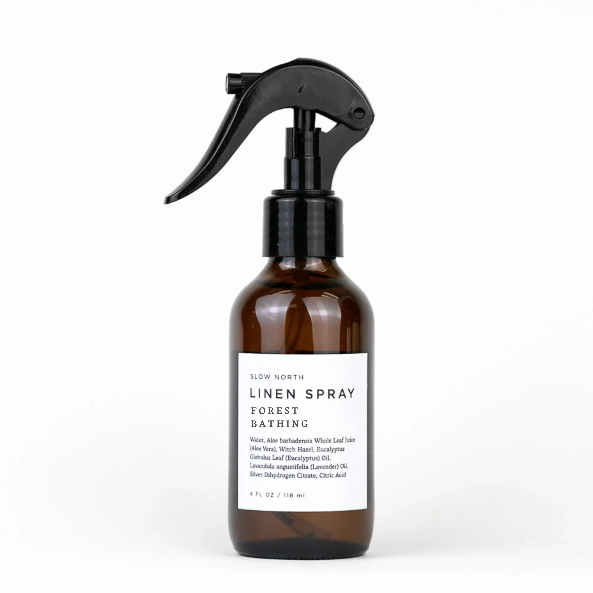 Slow North Linen Spray Forest Bathing in amber bottle with black spray top on white background