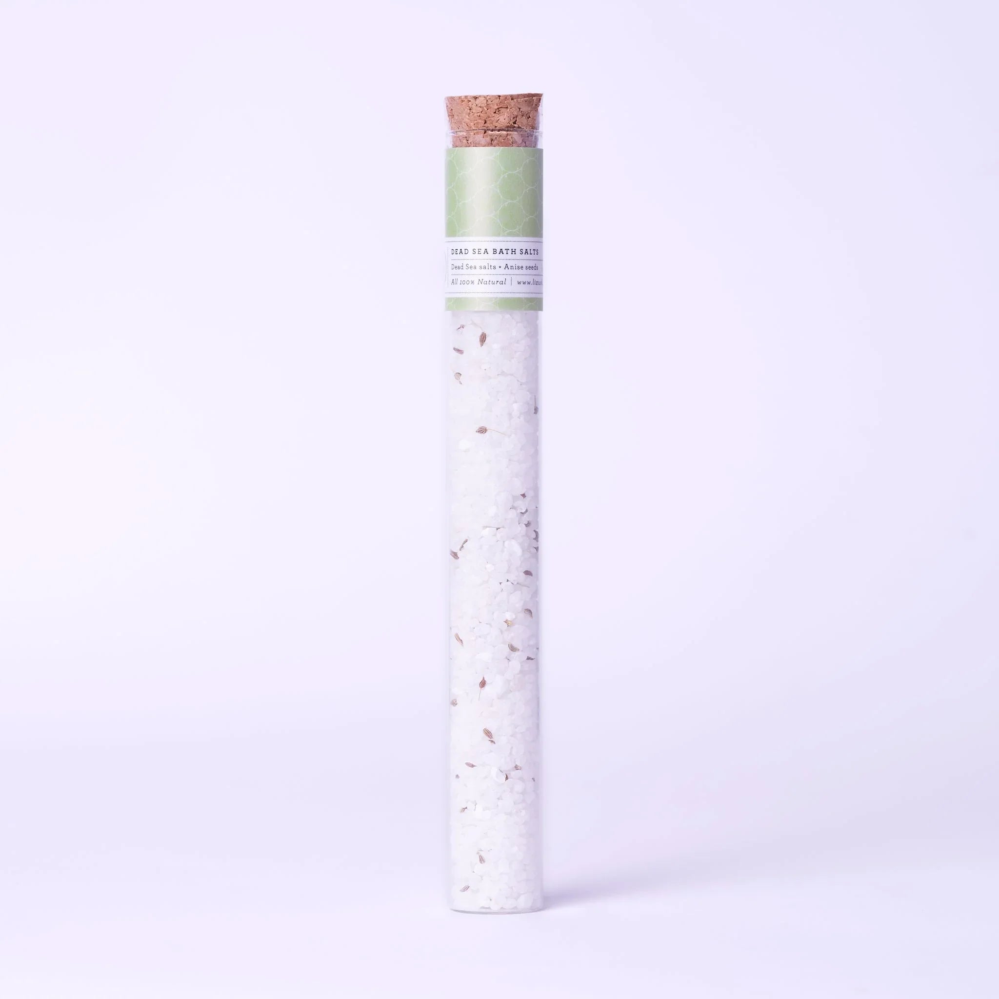 Test tube filled with Dead Sea bath salts and anise seeds, cork stopper, green label