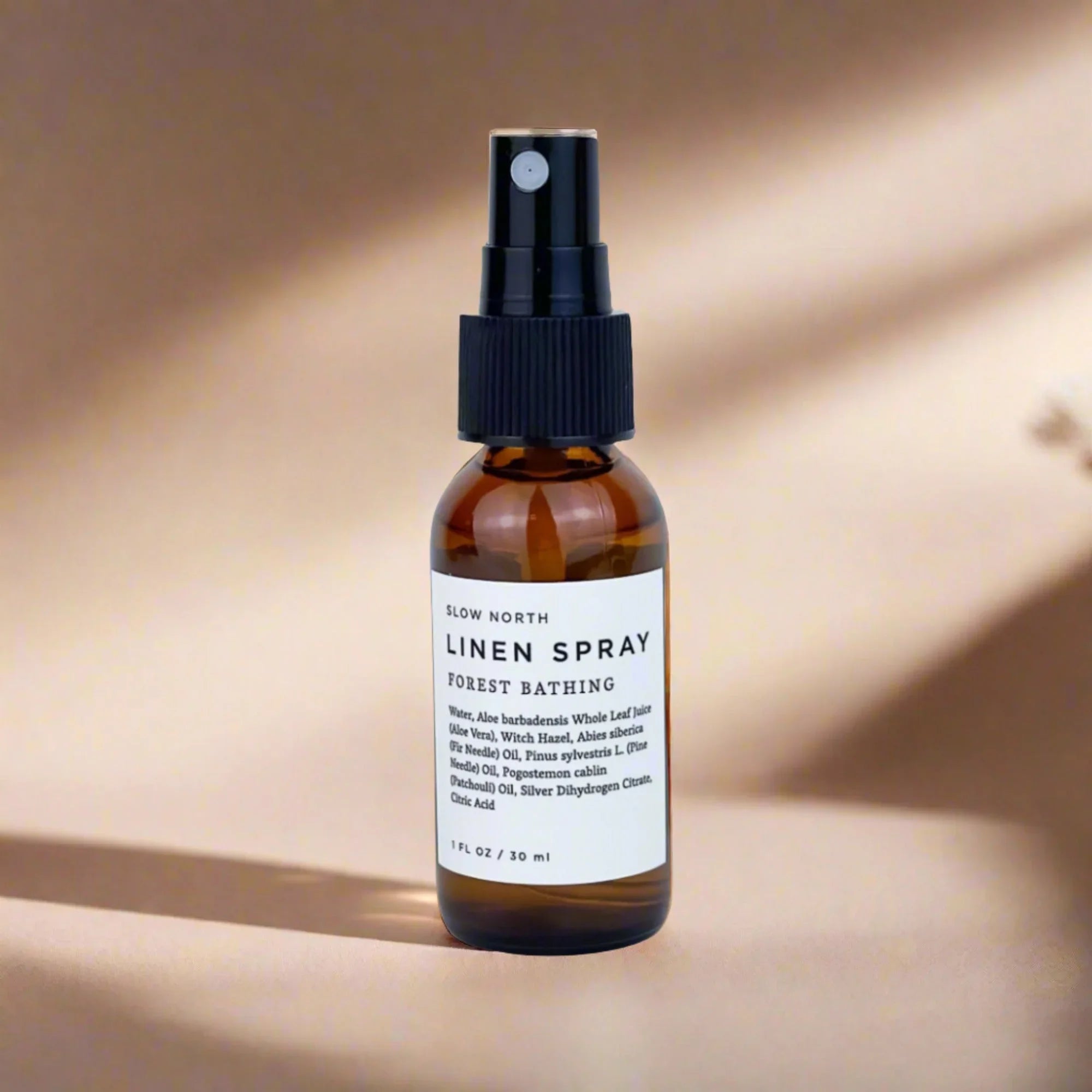 Slow North Linen Spray Forest Bathing in amber bottle on neutral background, eco-friendly gift