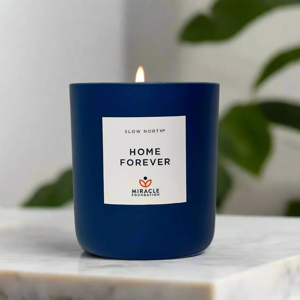 Blue SLOW NORTH Home Forever Miracle Foundation candle on marble, Qu!rk Boutique gift