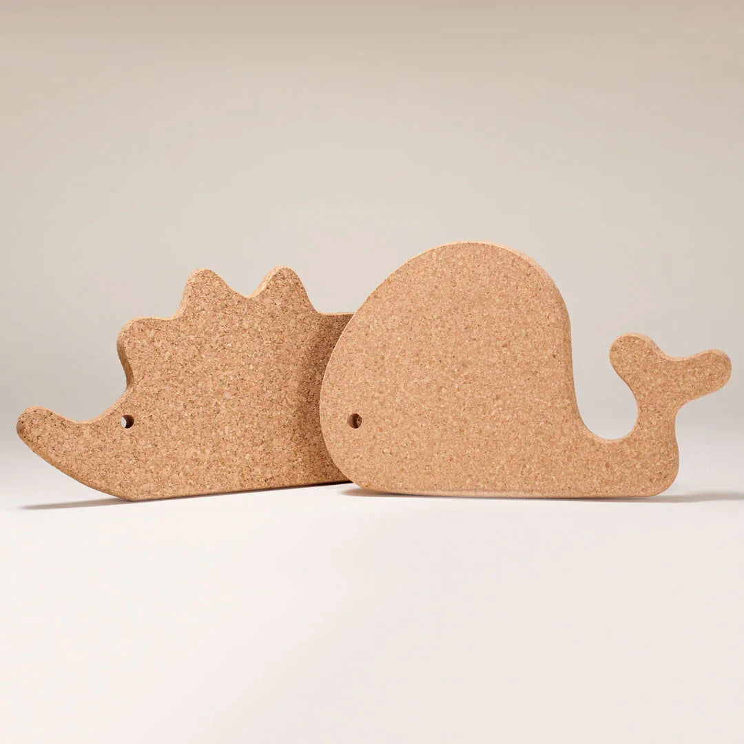Whale and hedgehog shaped cork boards on neutral background, fun eco-friendly decor gift