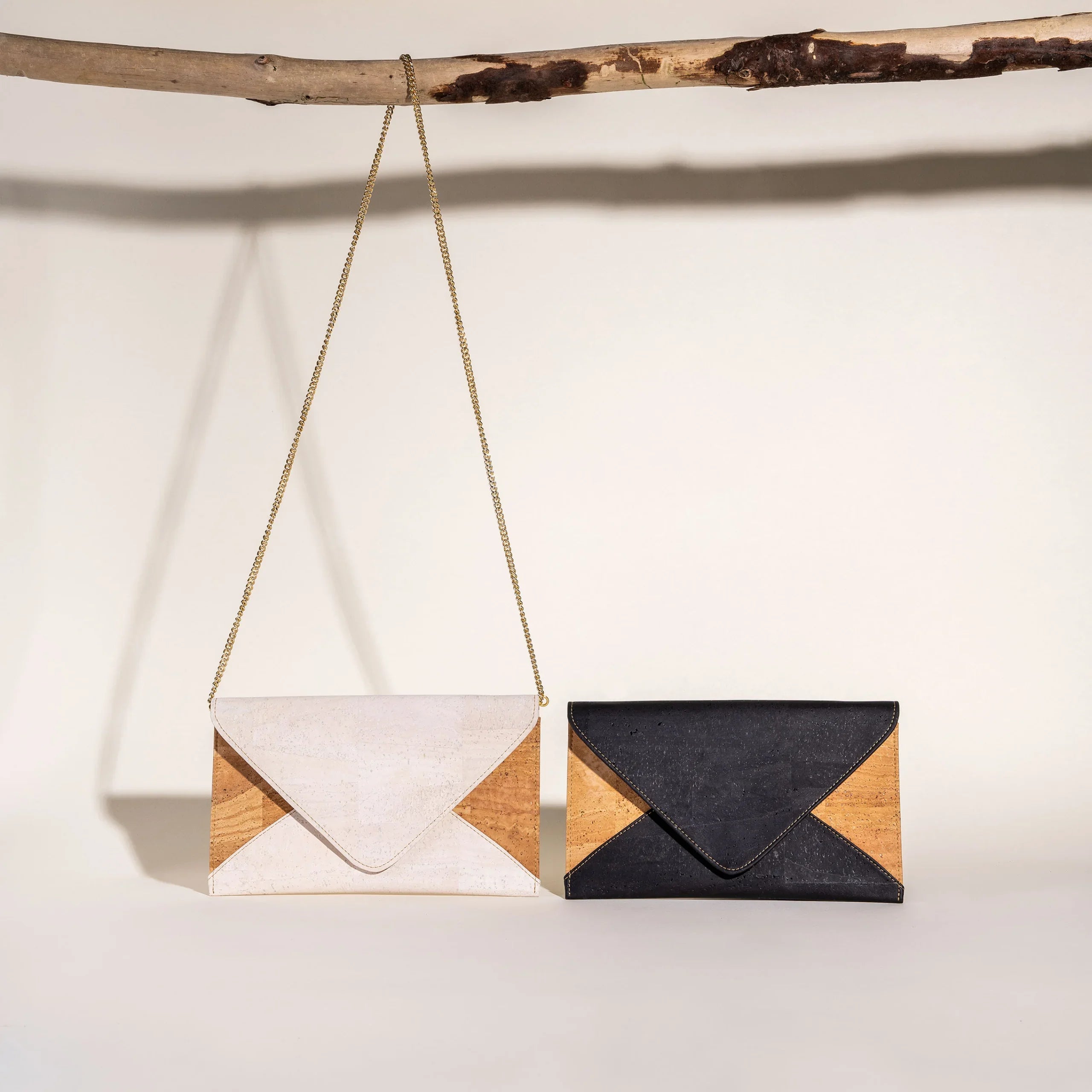 Two modern, geometric cork and vegan leather clutches in black and white from Qu!rk Boutique