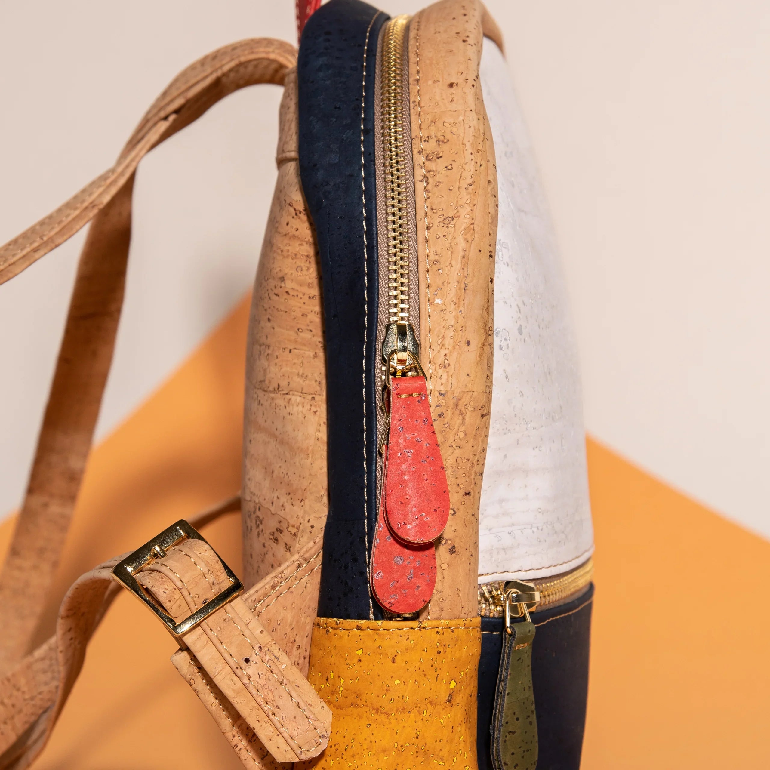 Colorful cork backpack with gold zippers, eco-friendly accessory at Qu!rk Boutique