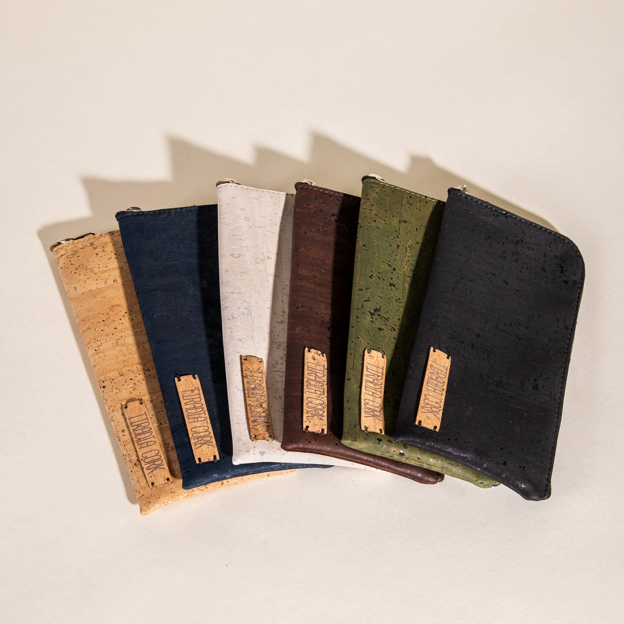 Sustainable cork wallets in assorted colors from Qu!rk Boutique, displayed on neutral background.