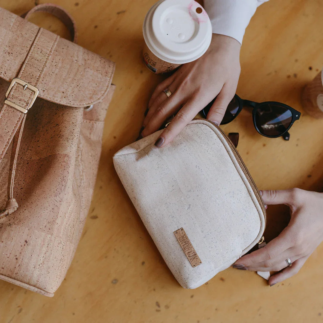 Sustainable cork backpack and pouch with sunglasses and coffee on table, Qu!rk Boutique