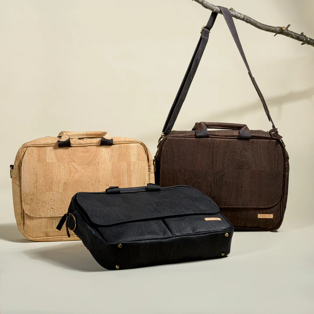 Three eco-friendly cork briefcase bags in tan, brown, and black, displayed on neutral backdrop