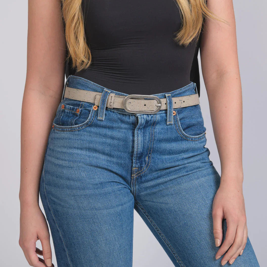 Woman wearing sustainable gray belt with blue jeans from Qu!rk Boutique