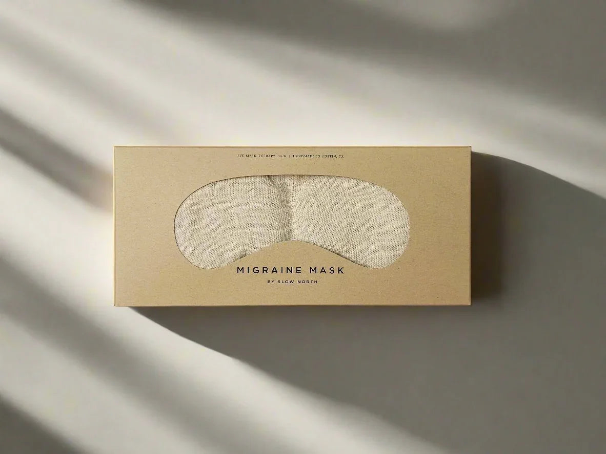 Natural migraine eye mask in eco-friendly packaging on neutral background at Qu!rk Boutique