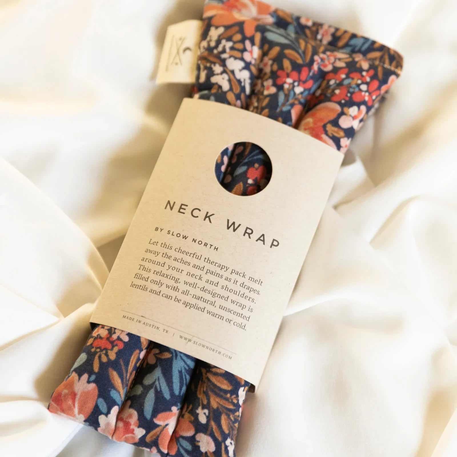 Floral neck wrap therapy pack by Slow North on white fabric, sustainable gift at Qu!rk Boutique