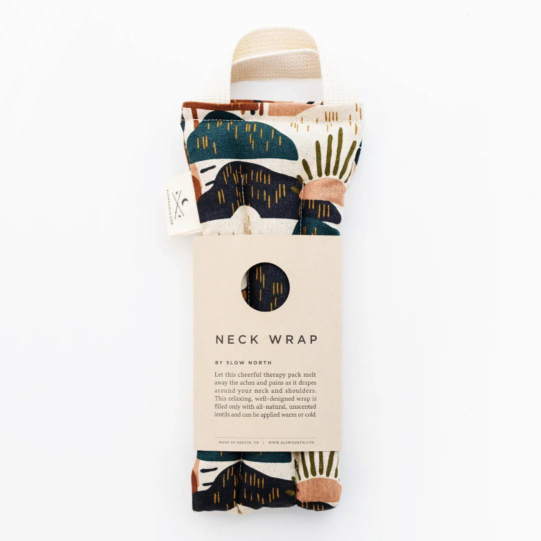 Slow North neck wrap therapy pack with abstract patterned fabric in green, navy, and brown tones
