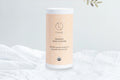 Lizush organic baby powder container with beige label on white cloth background