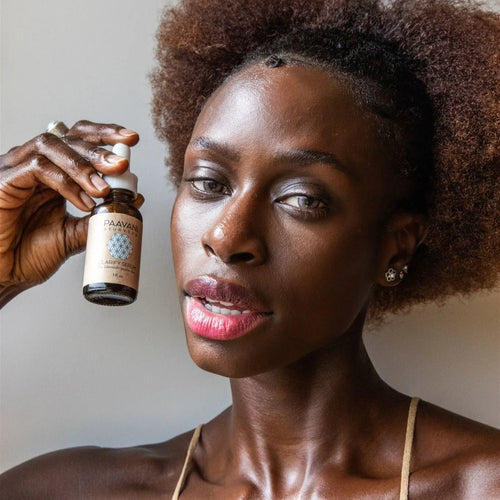 Woman showcasing Paavani Ayurvedic Clarify Serum, eco-friendly beauty at Qu!rk Boutique