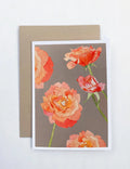 Notecard with watercolor peach roses on grey background and kraft envelope
