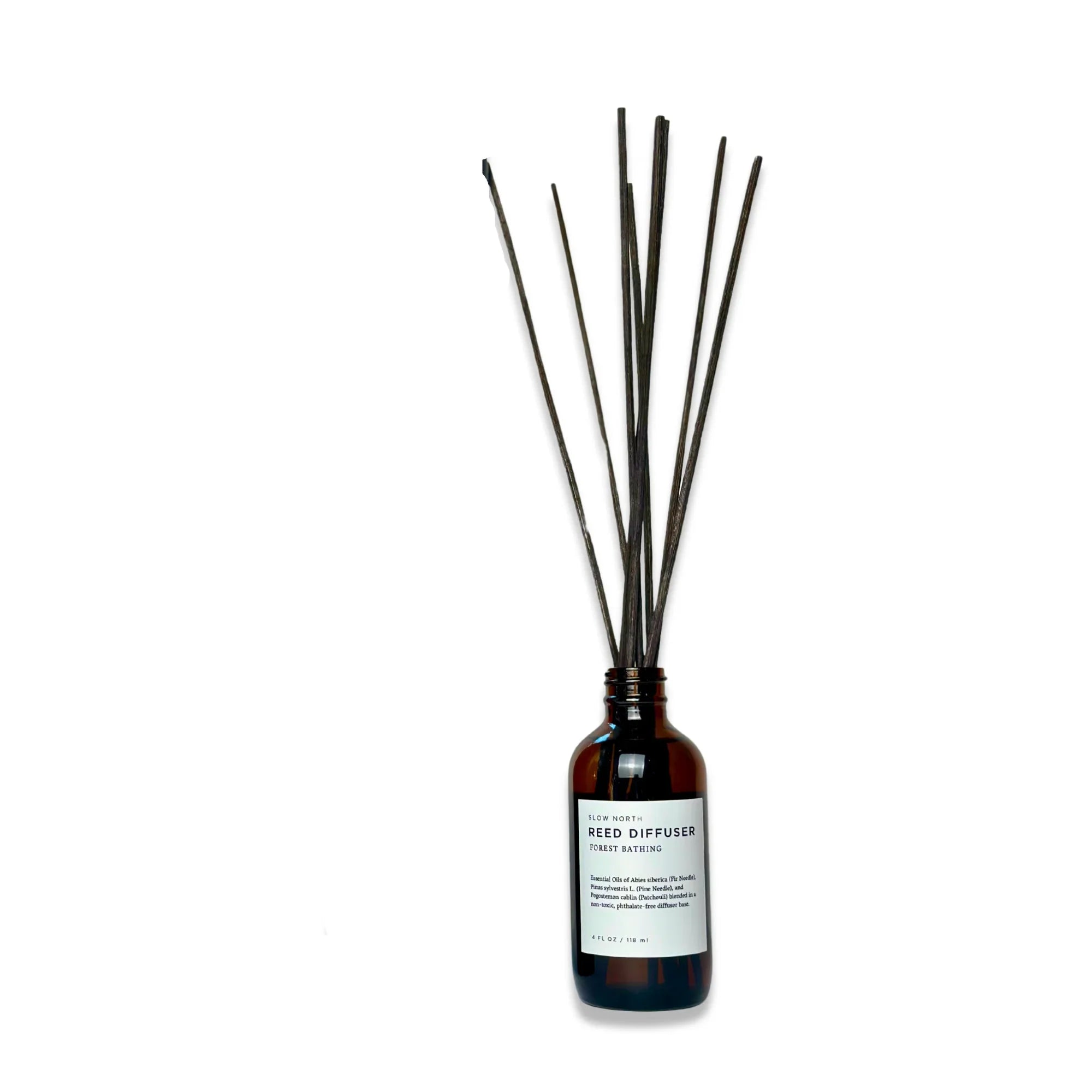Amber glass bottle reed diffuser with black reeds, artisan home fragrance from Qu!rk Boutique
