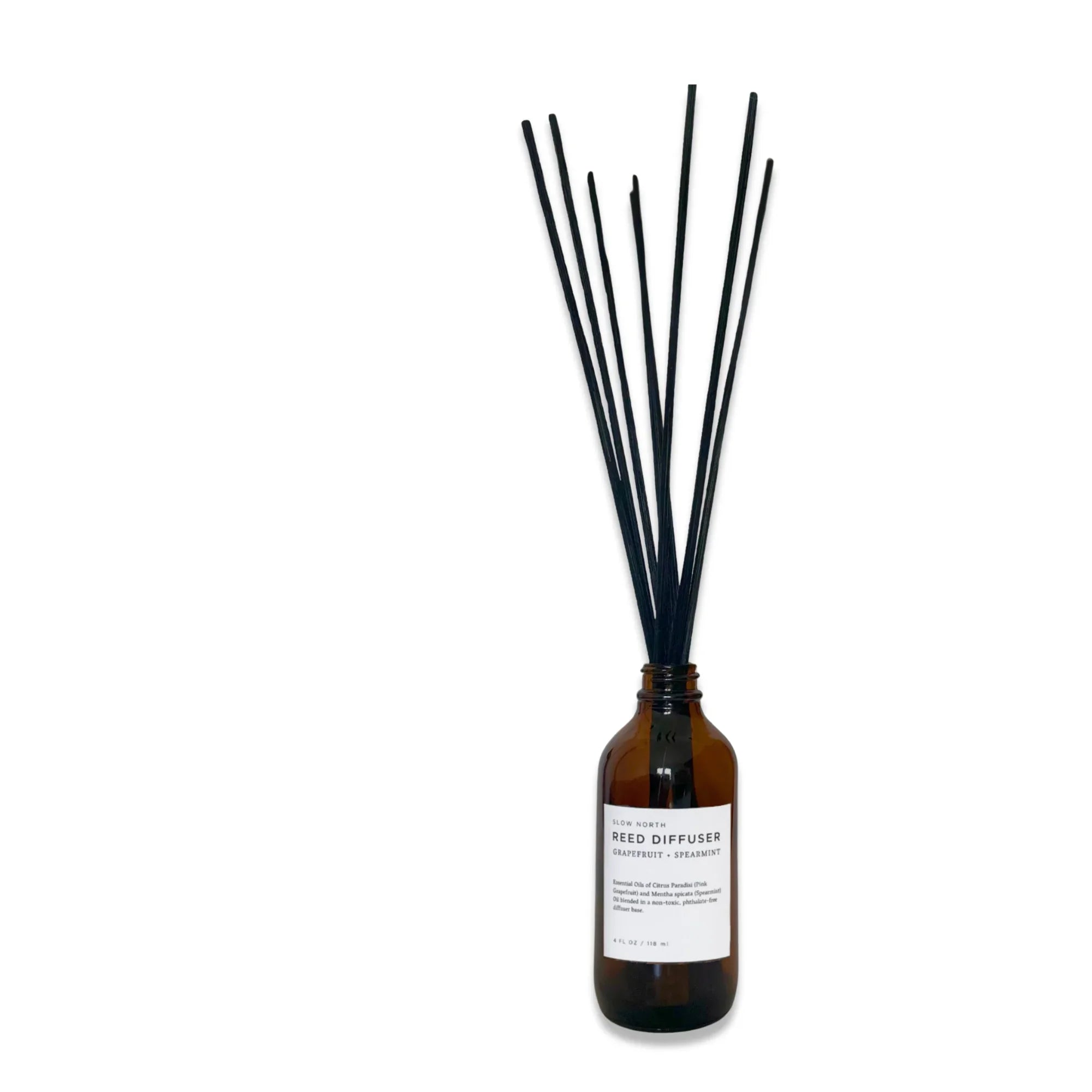 Brown glass bottle with black reed diffuser sticks labeled grapefruit and spearmint scent