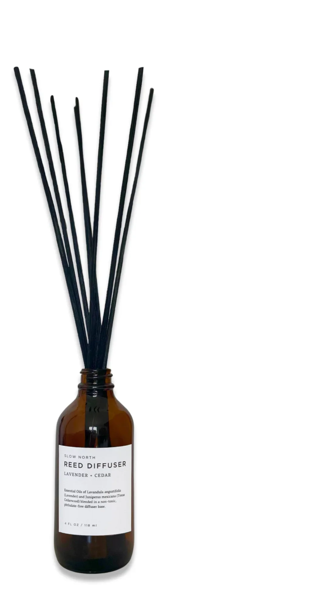 Amber glass bottle with black reed diffuser sticks for lavender and cedar scent