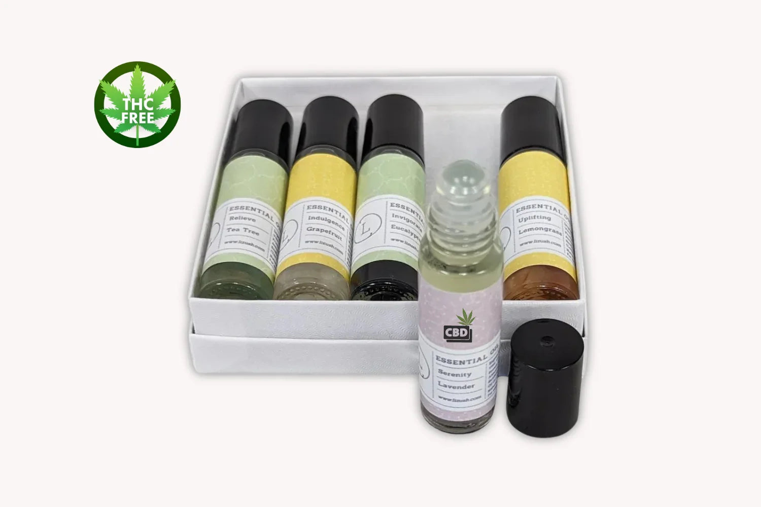 Set of five THC-free CBD essential oil roller bottles with labels for Tea Tree, Grapefruit, Eucalyptus, Lemongrass, and Lavender